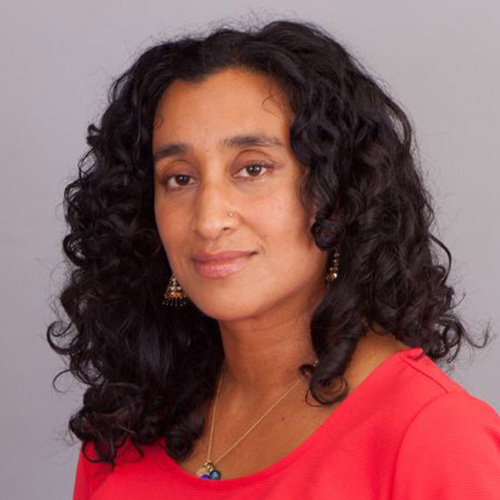 headshot of woman with medium dark skin tone
