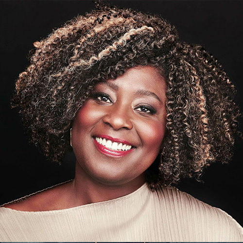 headshot of woman with dark skin tone