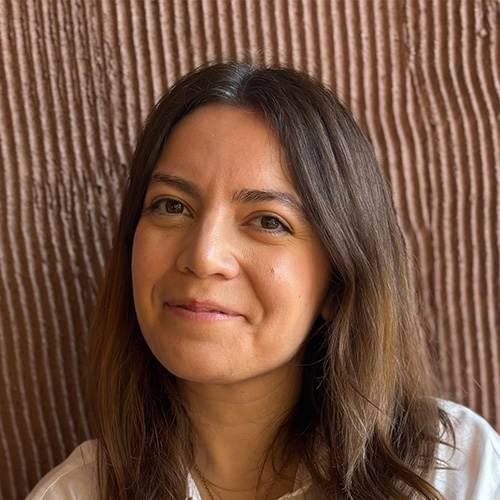 headshot of woman with medium brown hair and brown eyes