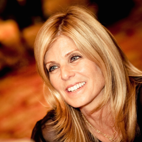 Headshot of woman with light blond hair and dark eyes 
