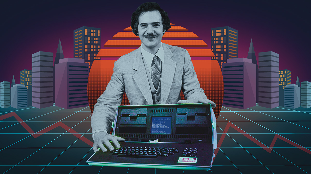 Osborne standing behind retro looking computer smiling at camera