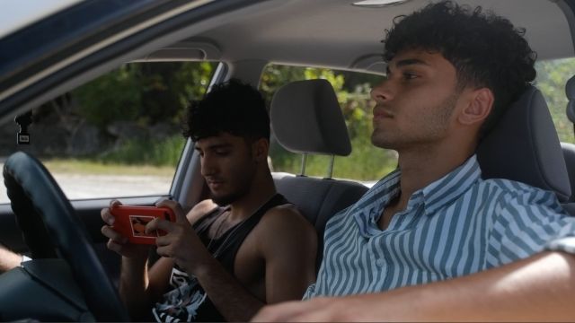 Yosef and Sam waiting in the car at the quarry.